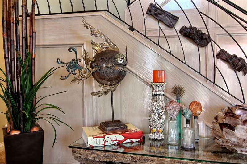 Arrangement of personalized objects to add interest to home decor